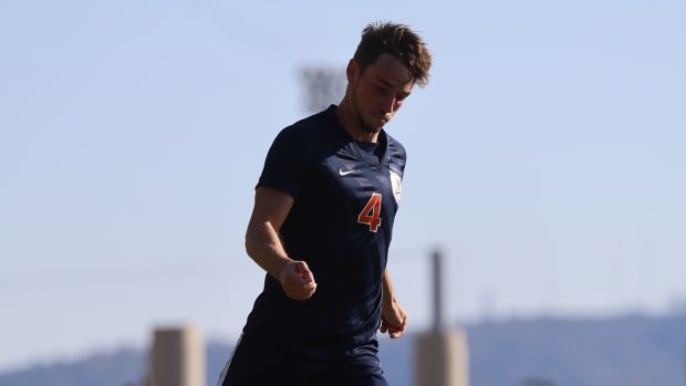 Paul Wiese dribbles the ball during the Virginia men's soccer match against Syracuse in the quarterfinals of the ACC Men's Soccer Championship at Klockner Stadium.